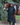 EQUIDRY women's long waterproof horse riding coat in black/peacock pink shown by rider with horse