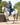EQUIDRY waterproof horse riding raincoat All Rounder Original thick fleece Women's Navy/Raspberry side view on horse