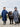 EQUIDRY waterproof horse riding raincoat thin fleece pro ride reflective in navy and charcoal/pale pink children's kids stood in arena with shetland