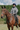 EQUIDRY women's waterproof short blouson style horse riding jacket in charcoal/penelope pink sat on horse